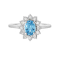Blue Topaz & Diamond Halo Ring